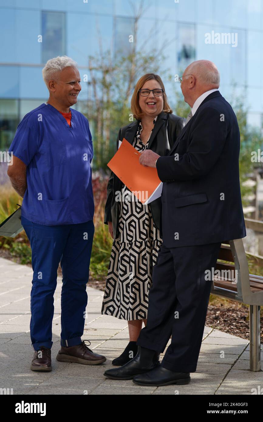 Katie Mitchell, 50, who was one of the youngest patients to undergo lifesaving surgery heart-lung transplant surgery in 1987, is reunited with her surgeon Professor John Wallwork (right) and consultant transplant physician Dr Jas Parmar, at the Royal Papworth Hospital NHS Foundation Trust, in Cambridge, to celebrate the 35th anniversary of her surgery. Picture date: Thursday September 29, 2022. Stock Photo