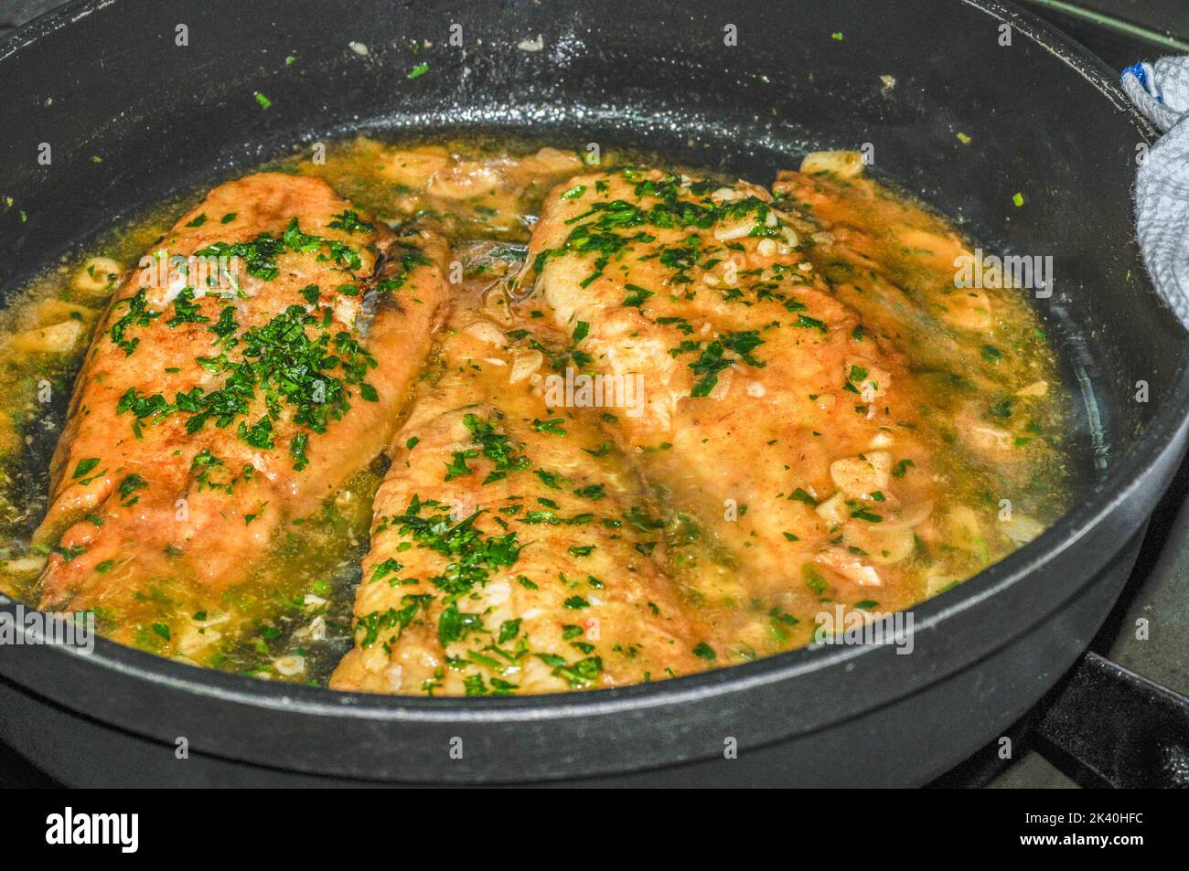 Sole meuniere with parsley and lemon. Stock Photo