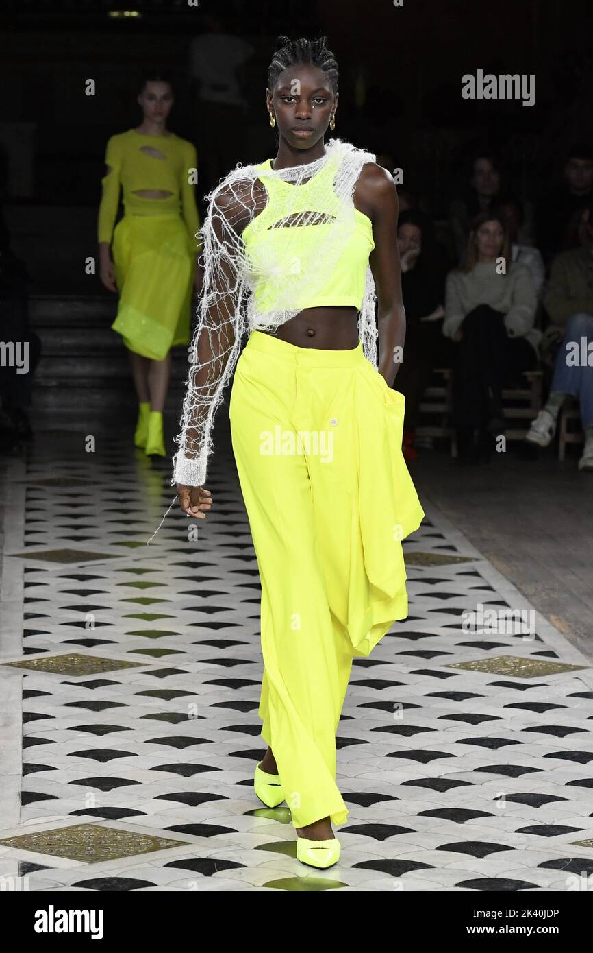 A model walks on the runway at the Undercover fashion show during the