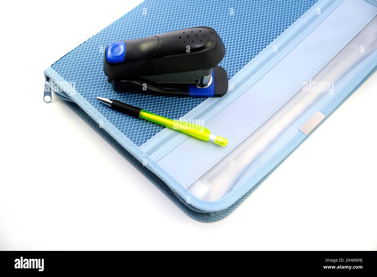 Deep blue file folder, stapler and pen, isolated on white stock photo ...