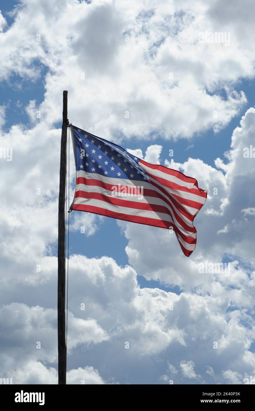 American flag blue sky white clouds hi-res stock photography and images ...