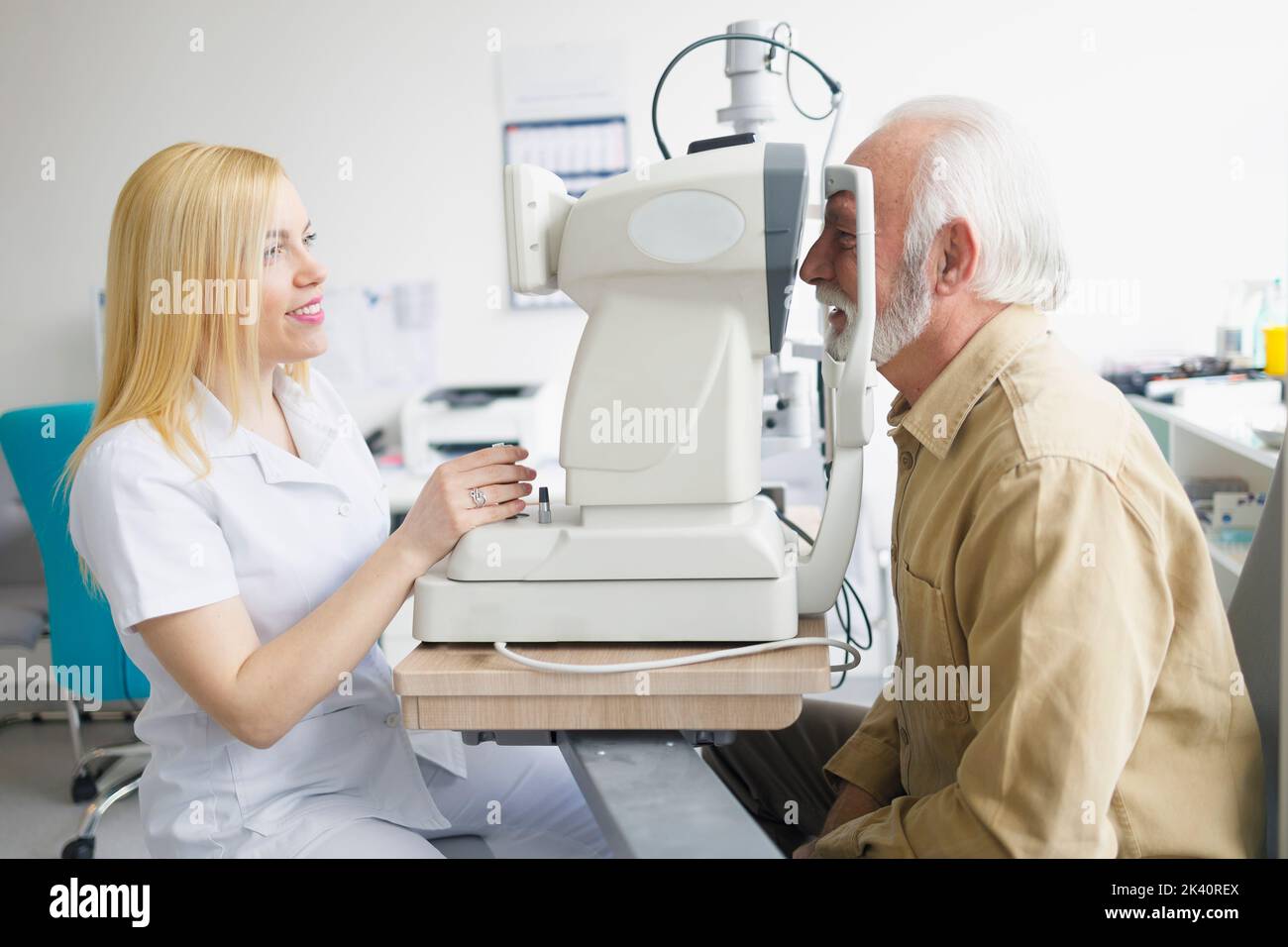 Female doctor examining her elderly patient Stock Photo