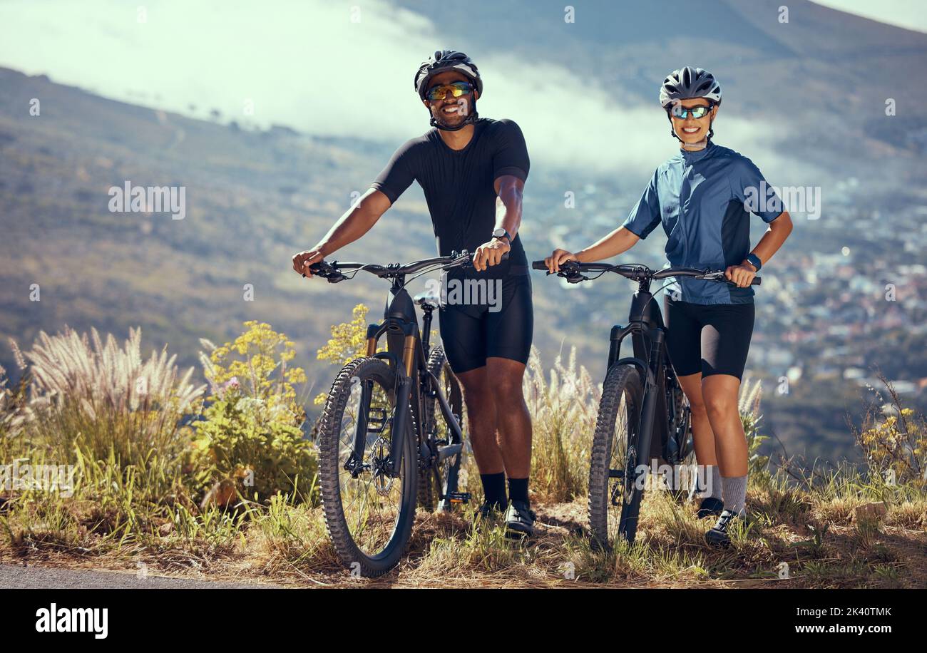 Couple, bicycle and adventure trail on a mountain for outdoor fitness, health and exercise. Cardio, cycling and sport people with healthy, workout and Stock Photo
