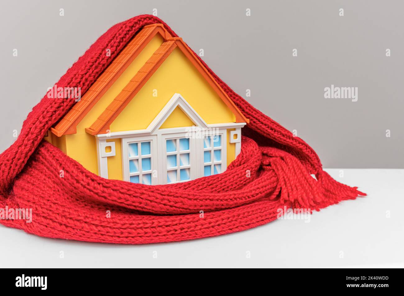 The house is wrapped in a warm scarf. Stock Photo