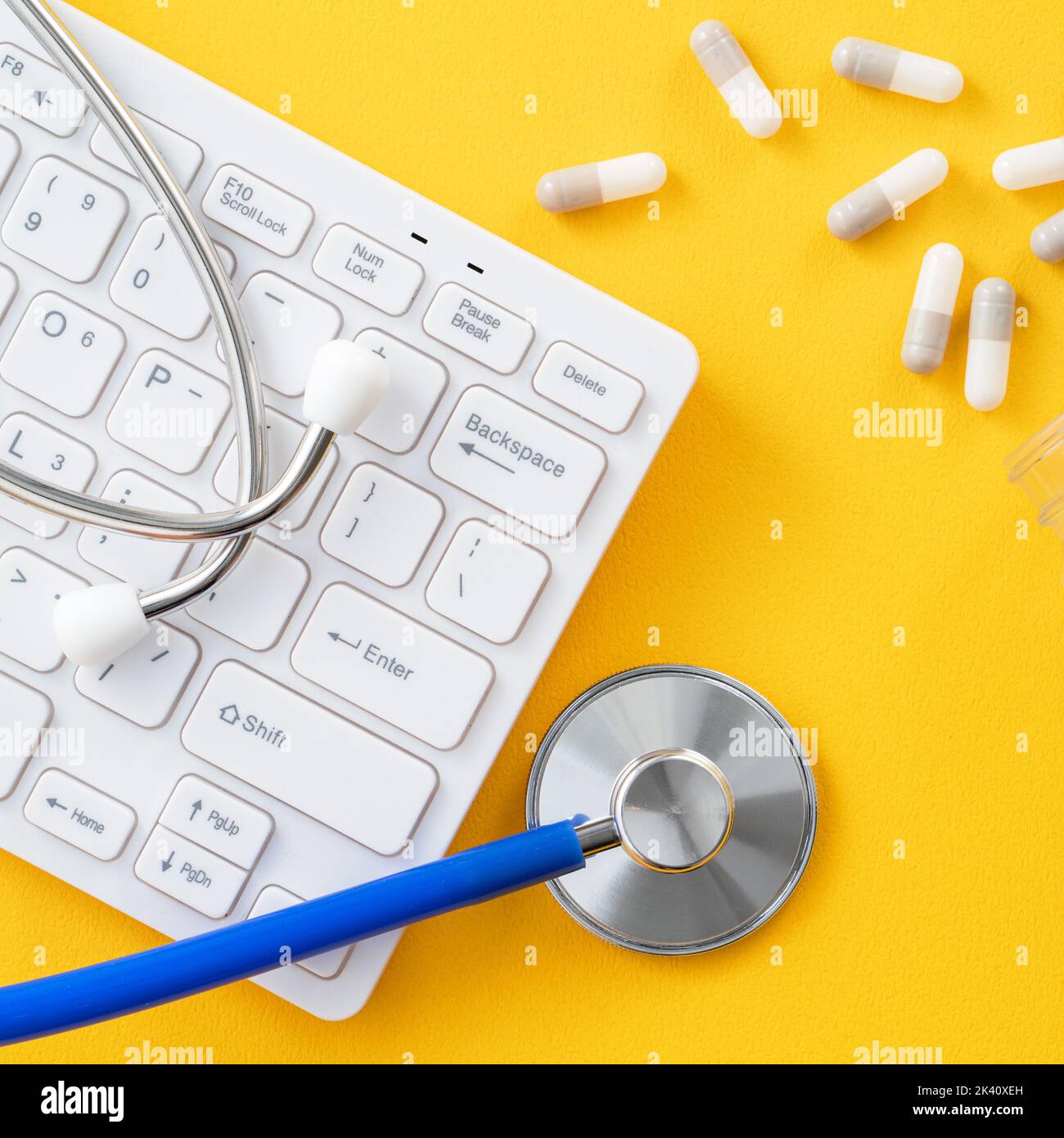 Doctor diagnoses design concept stethoscope with computer keyboard