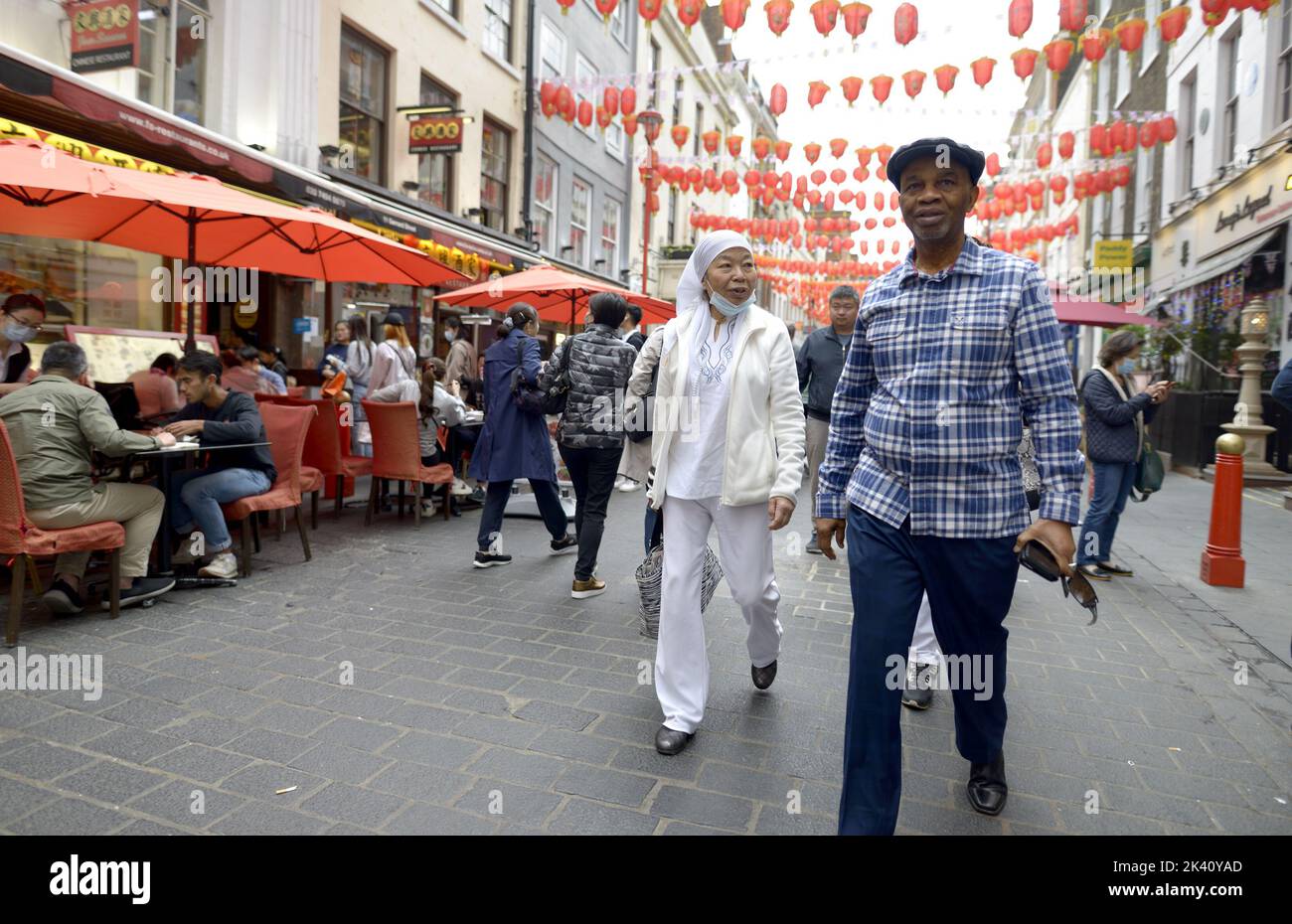 London, England, UK. Older ethnically diverse people in Chinatown Stock Photo