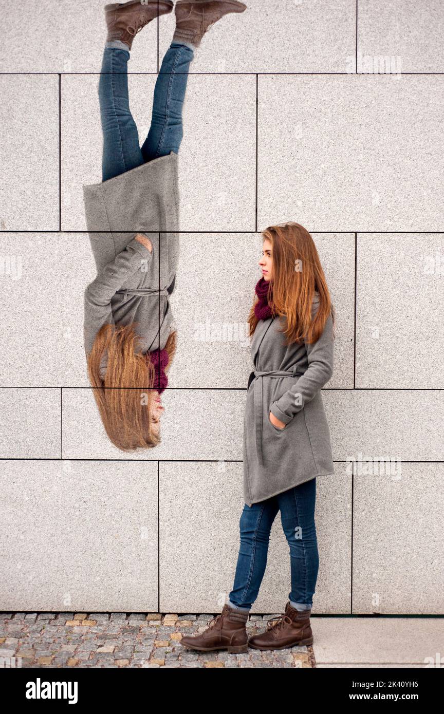 teenager girl leaning against a wall with copy space Stock Photo