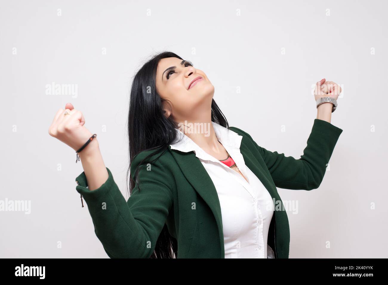 Excited happy woman with fists up isolated on white background Stock Photo