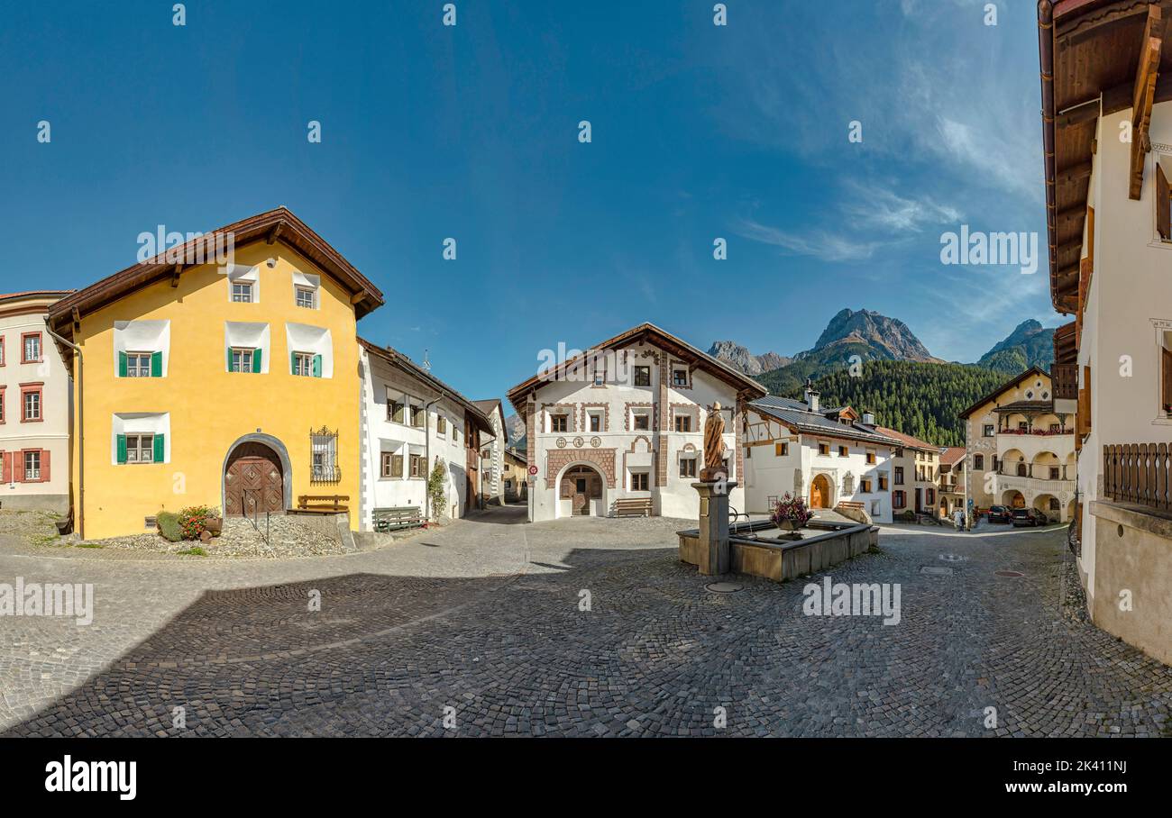 Engadine houses around a water source at the square Plaz *** Local Caption ***  Scuol,  Graubünden, Switzerland, city, village, autumn, mountains, hil Stock Photo
