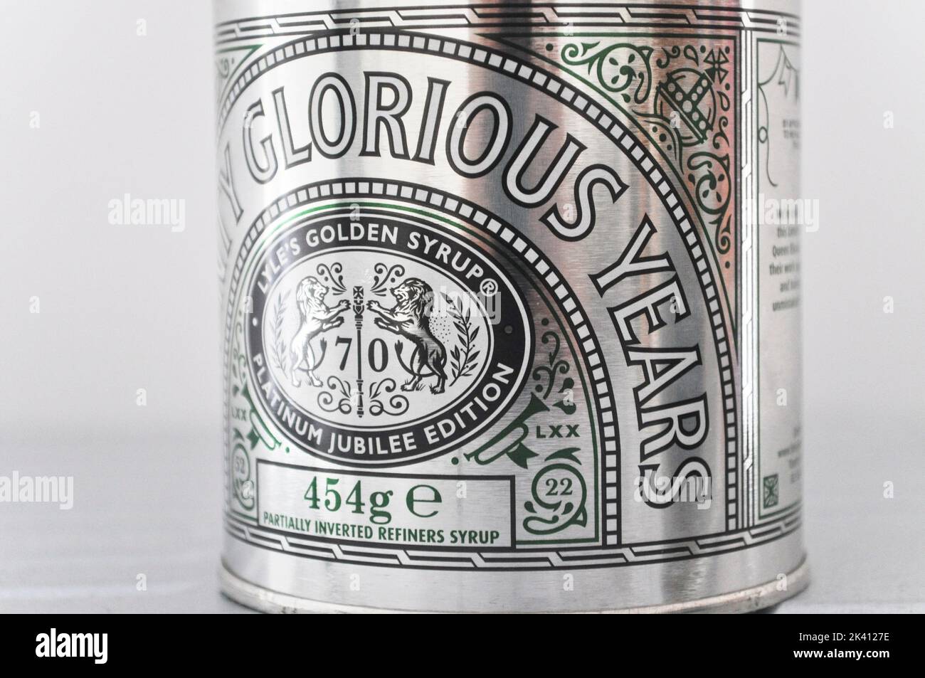 Special edition Lyle's Golden Syrup tin set against a white background. Seventy Glorious Years Platinum edition. Stock Photo
