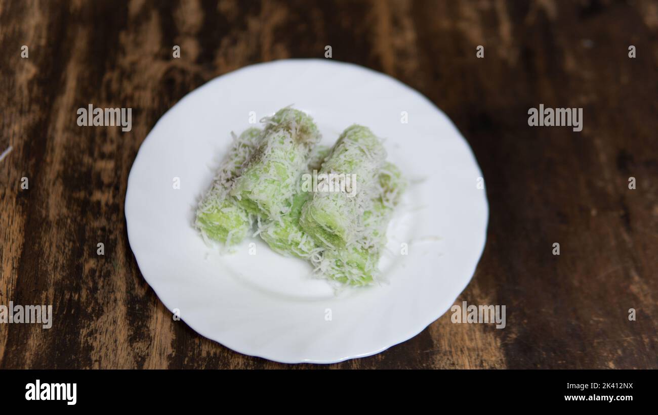 'Kuih putu bambu' is a cake made from rice flour and formed using bamboo molds. The aroma of pandan leaves from this cake is very appetizing. Stock Photo