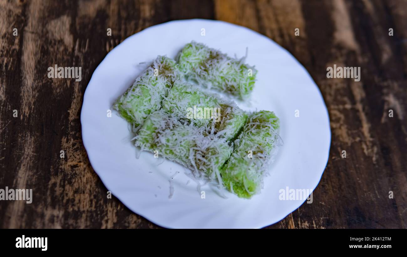 'Kuih putu bambu' is a cake made from rice flour and formed using bamboo molds. The aroma of pandan leaves from this cake is very appetizing. Stock Photo
