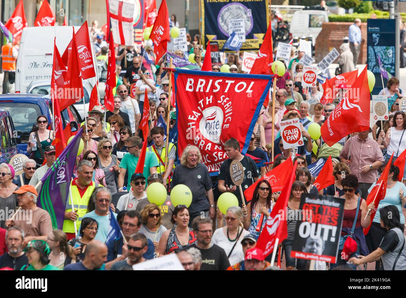 Protesters are pictured carrying trade union banners and placards during a public sector union workers strike and rally in Bristol. 10th July, 2014 Stock Photo
