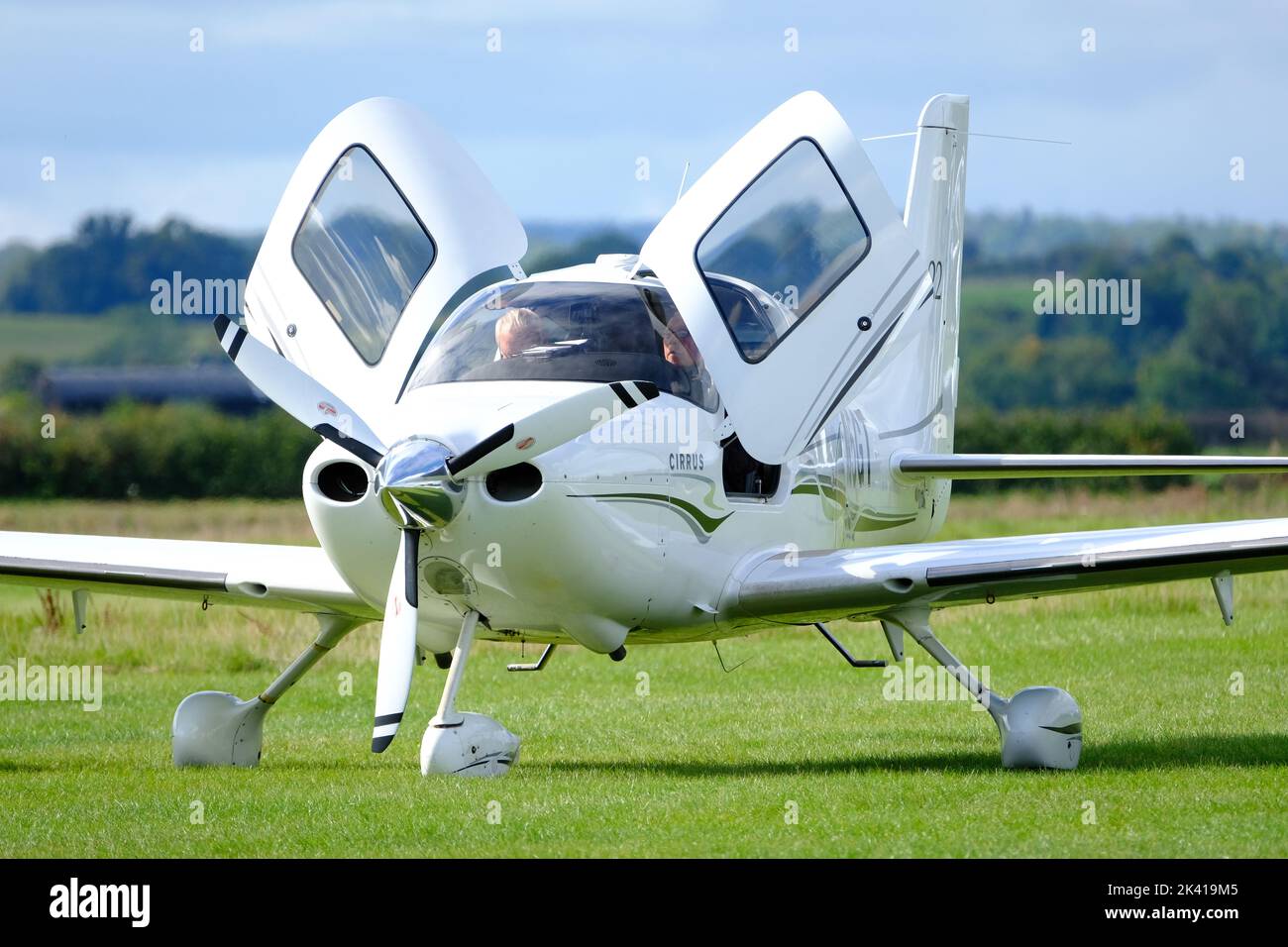 Cirrus SR22 modern popular US built light aircraft made from composite material with cockpit doors open Stock Photo
