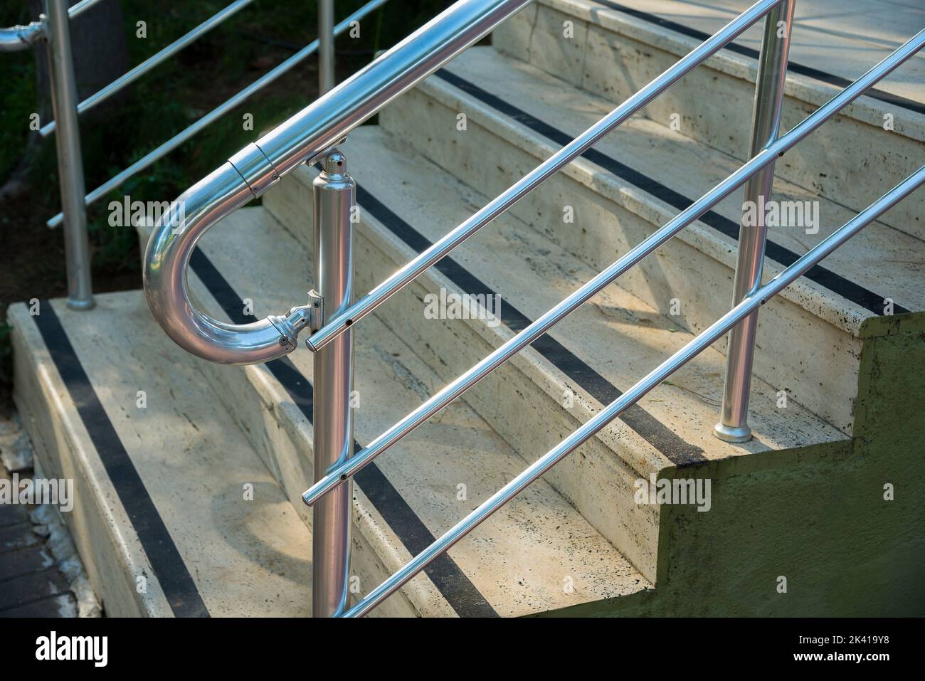 Concrete stairs with stainless handrails. Anti slip tape on stairs Stock Photo Alamy