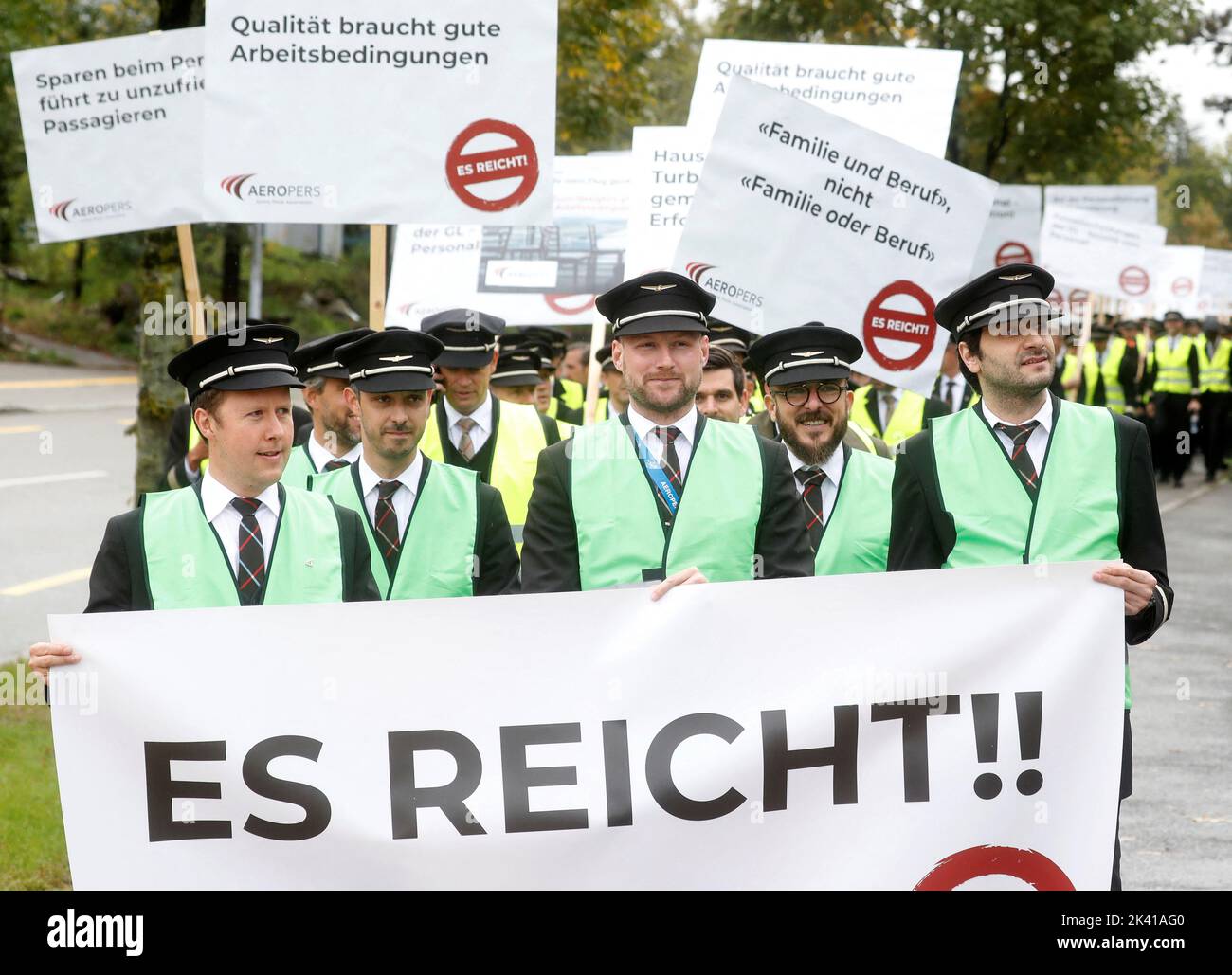 Members of AEROPERS - Airline Pilots Association carry posters on their march to protest in front of the headquarters of Swiss International Air Lines in Kloten, Switzerland September 29, 2022.  REUTERS/Arnd Wiegmann Stock Photo