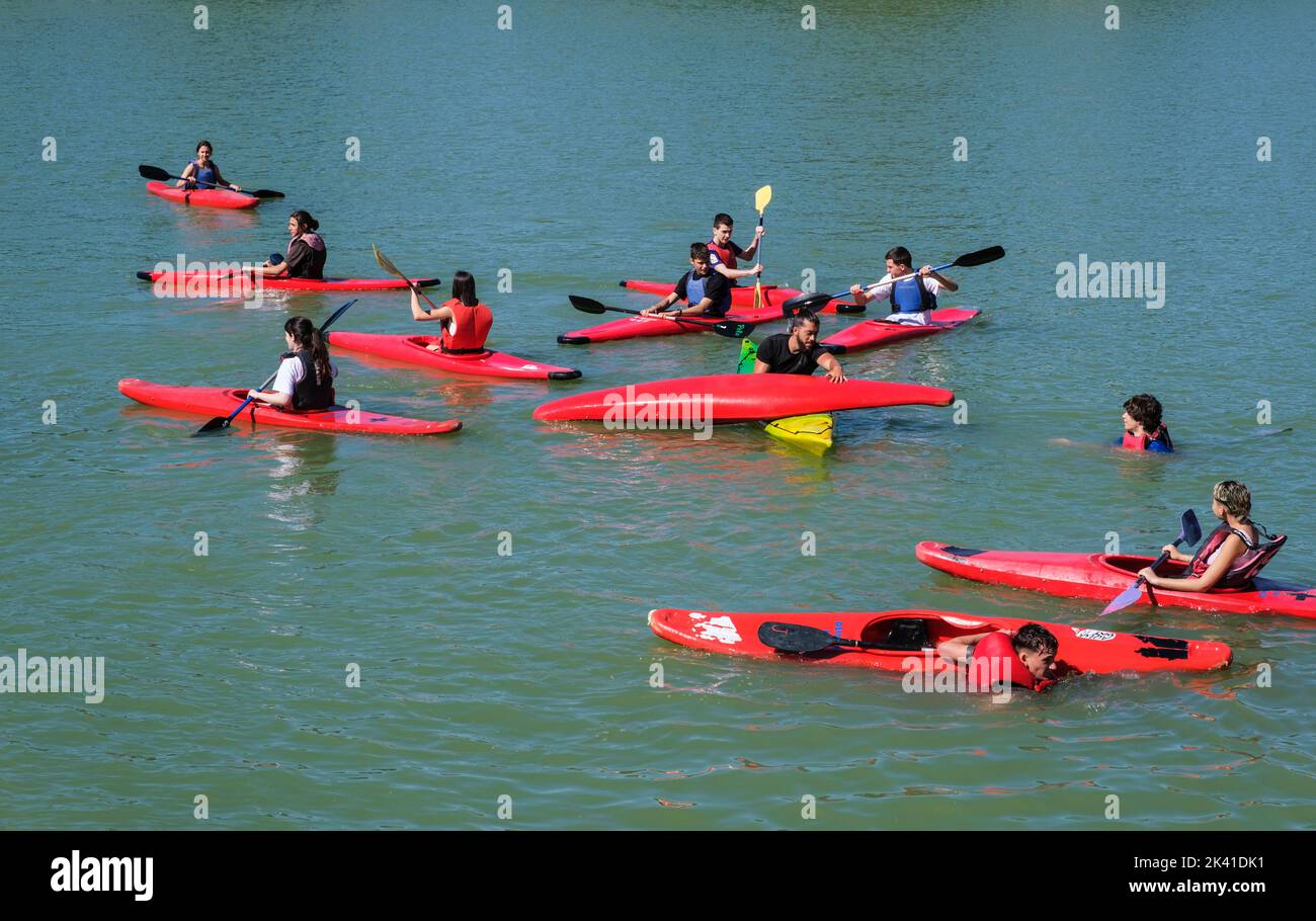 Spain, Madrid. Kayakers on El Retiro Lake, by Monument to Alfonso XII, El Retiro Park. Stock Photo