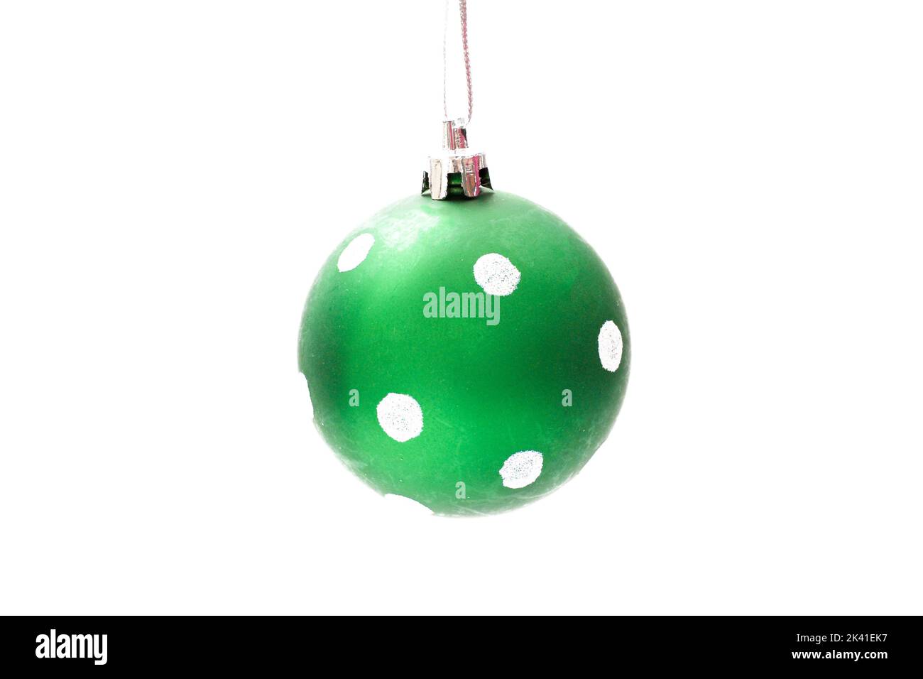 Green Christmas Baubles with white dots on a white background Stock