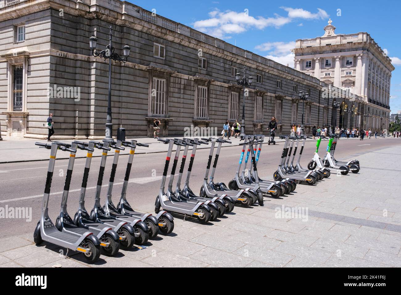 Spain, Madrid. Motorized Scooters for Rent, Opposite the Royal Palace