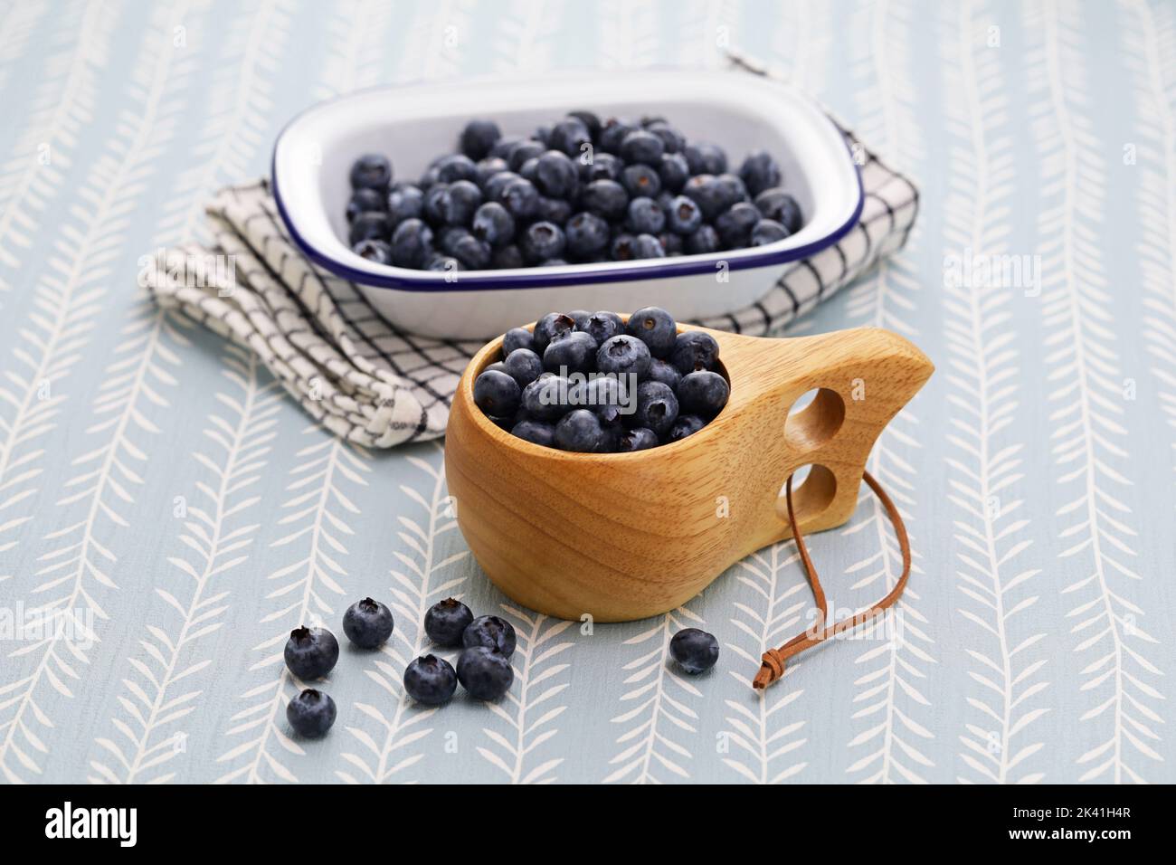 Kuksa(Finnish wooden mug) and fresh blueberries Stock Photo