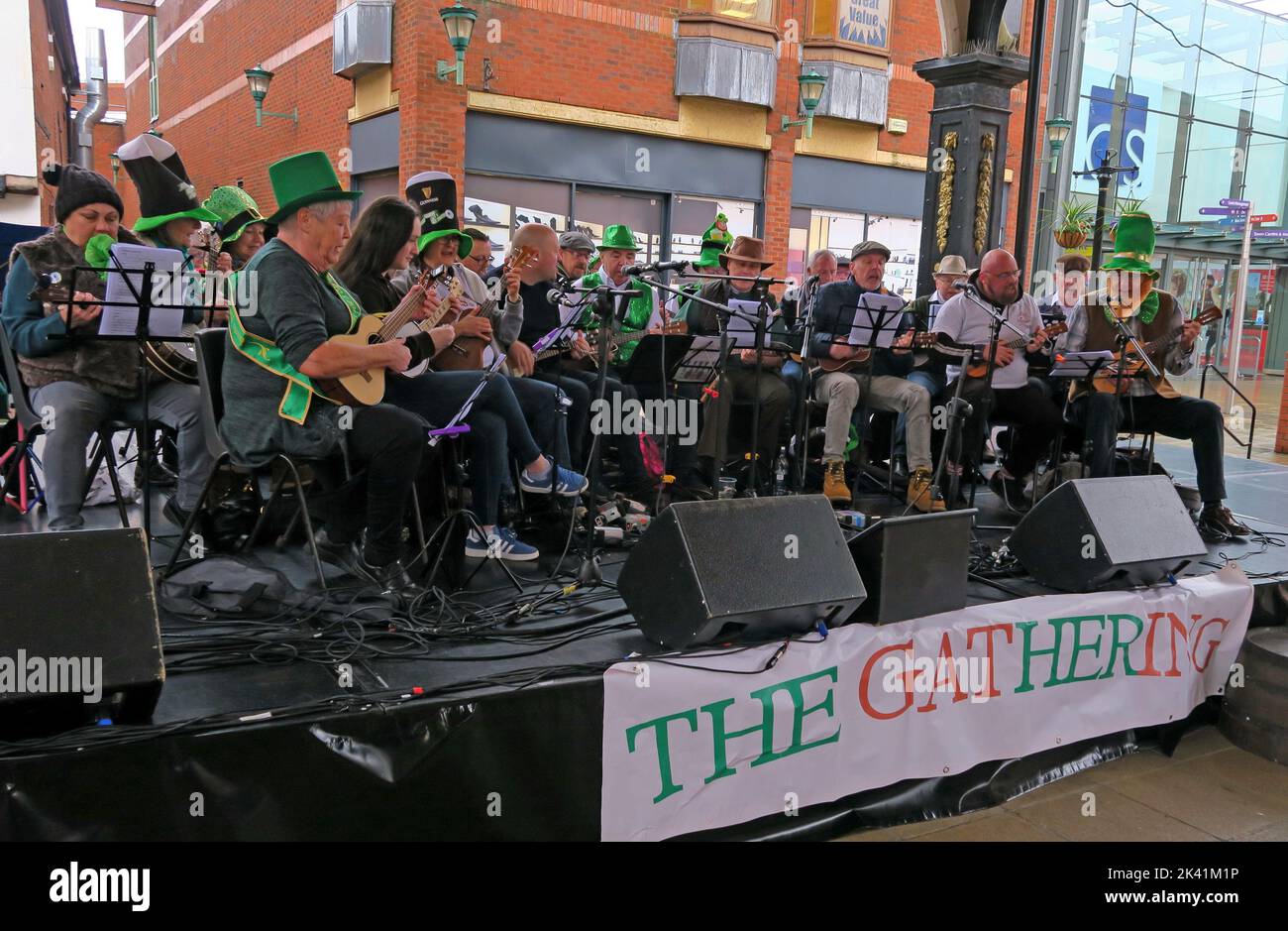 The Gathering, perform in Golden Square, Warrington, Cheshire, England, UK,  for St Patricks Day, March 2019 Stock Photo