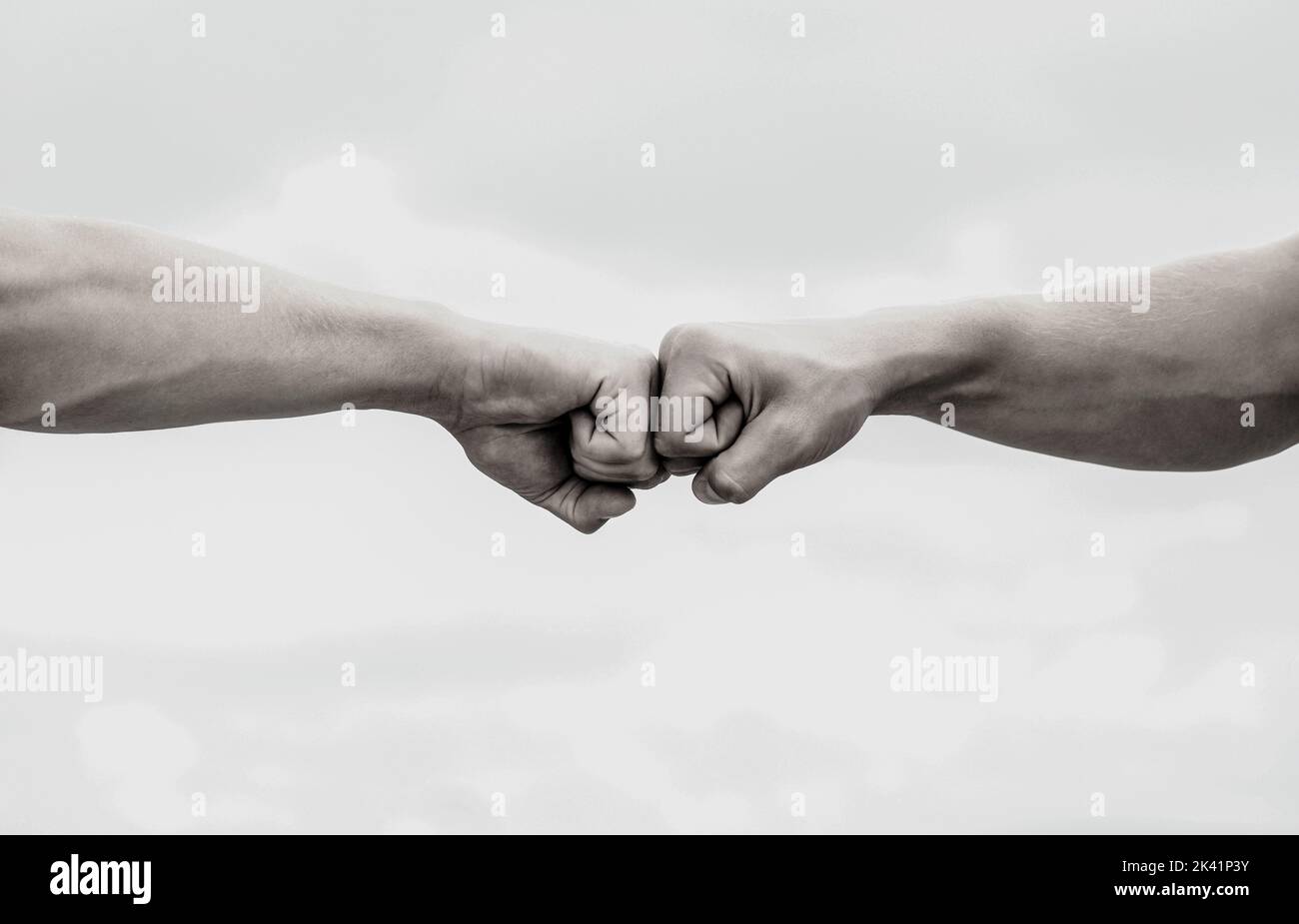 Teamwork and friendship. Partnership concept. Man giving fist bump ...