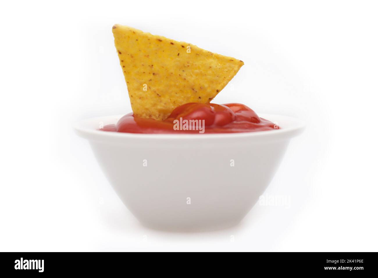 Tortilla nacho on hot chili sauce Stock Photo Alamy