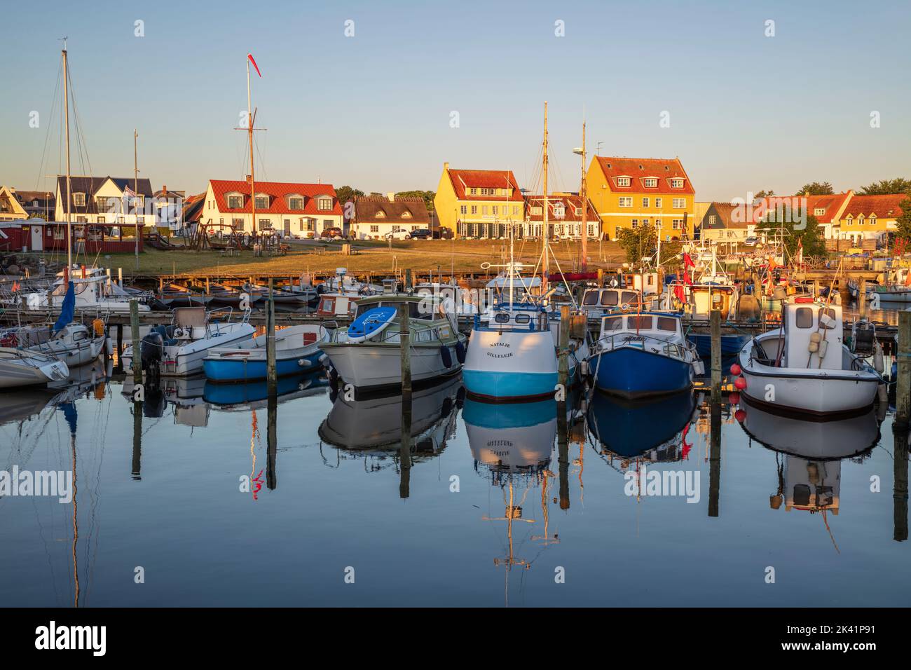 Fishing boats reflected in Gilleleje harbour at sunrise, Gilleleje, Zealand, Denmark, Europe Stock Photo
