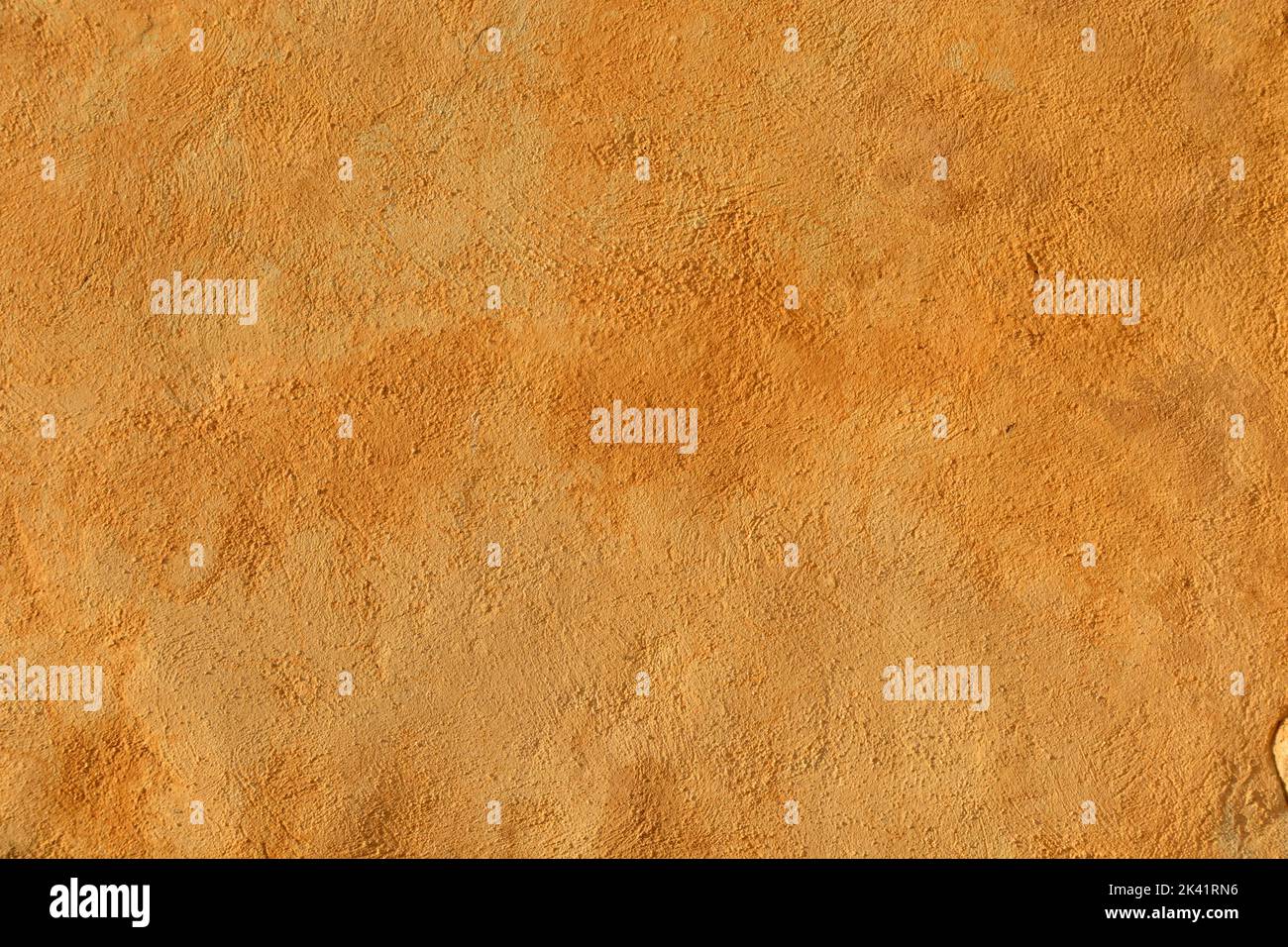 Orange colored plastered wall Stock Photo