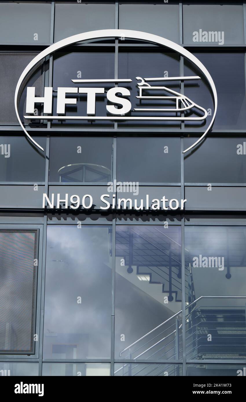20 September 2022, Lower Saxony, Faßberg: The lettering of HFTS (Helicopter Flight Training Services GmbH), NH90 Simulator stands on a building on the grounds of Faßberg Air Base. Photo: Philipp Schulze/dpa Stock Photo