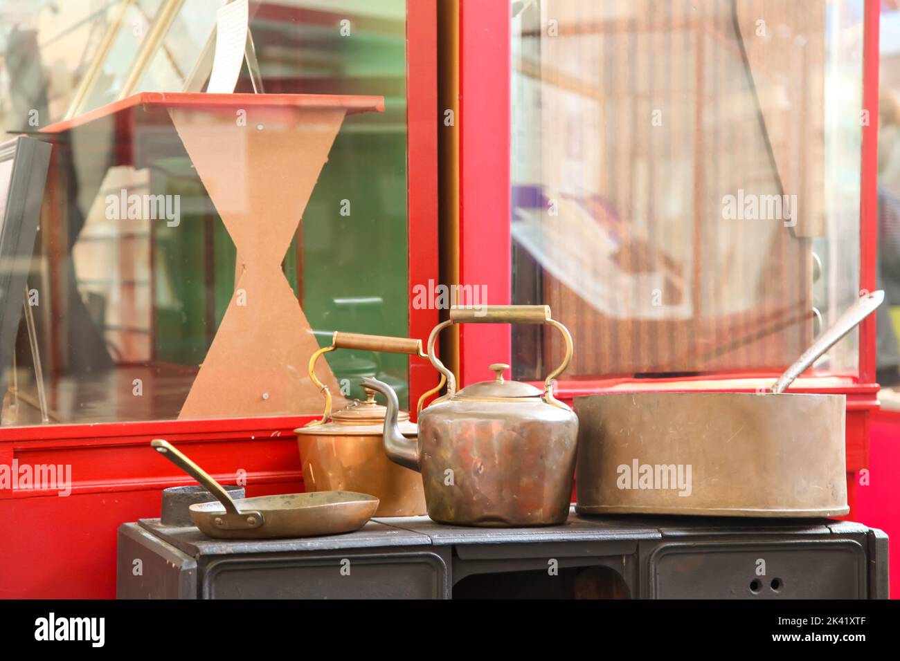Old copper kettle and cooking items on stove on display at the Bourne