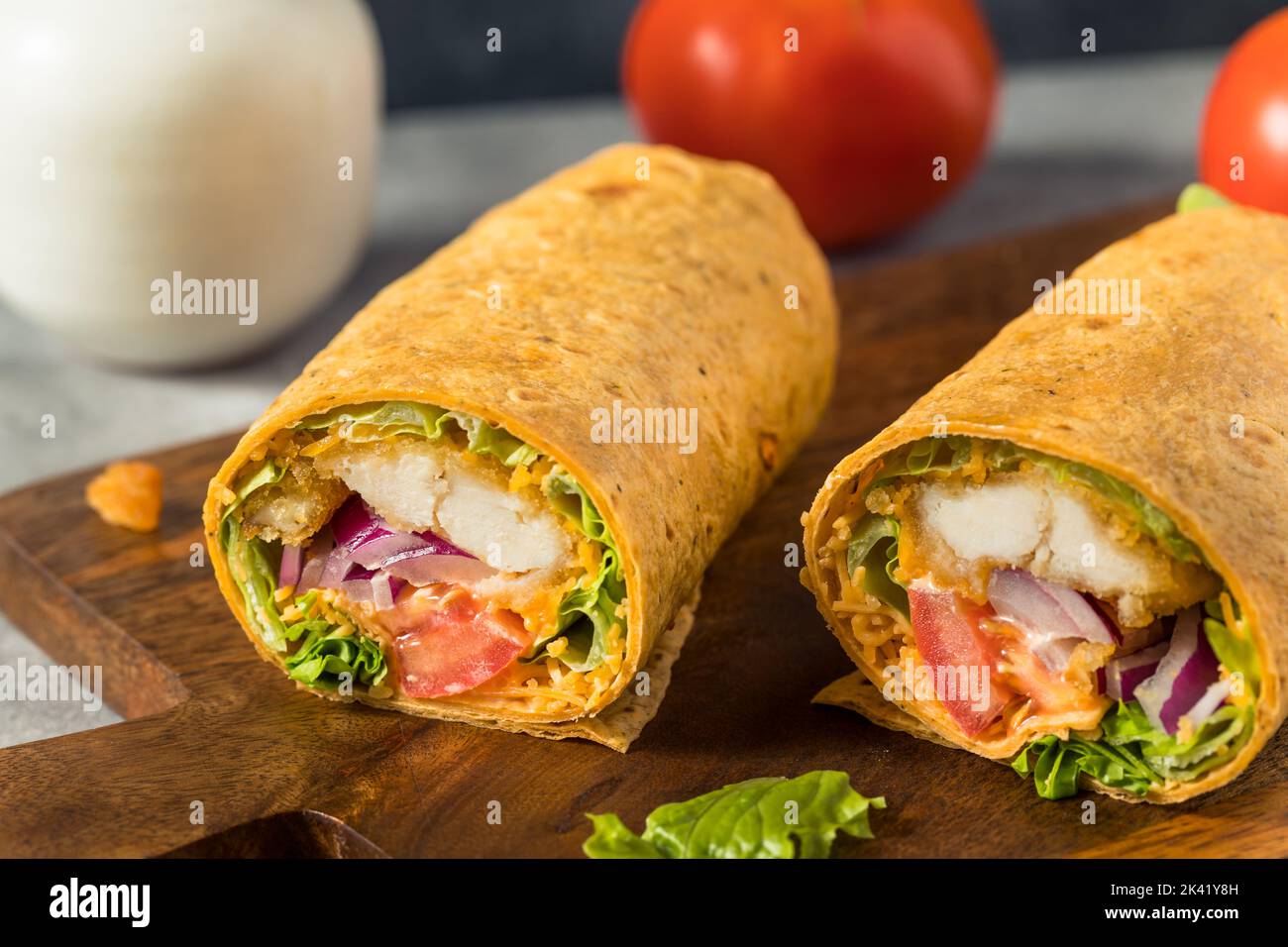 Homemade Fried Chicken Wrap with Lettuce and Tomato Stock Photo Alamy