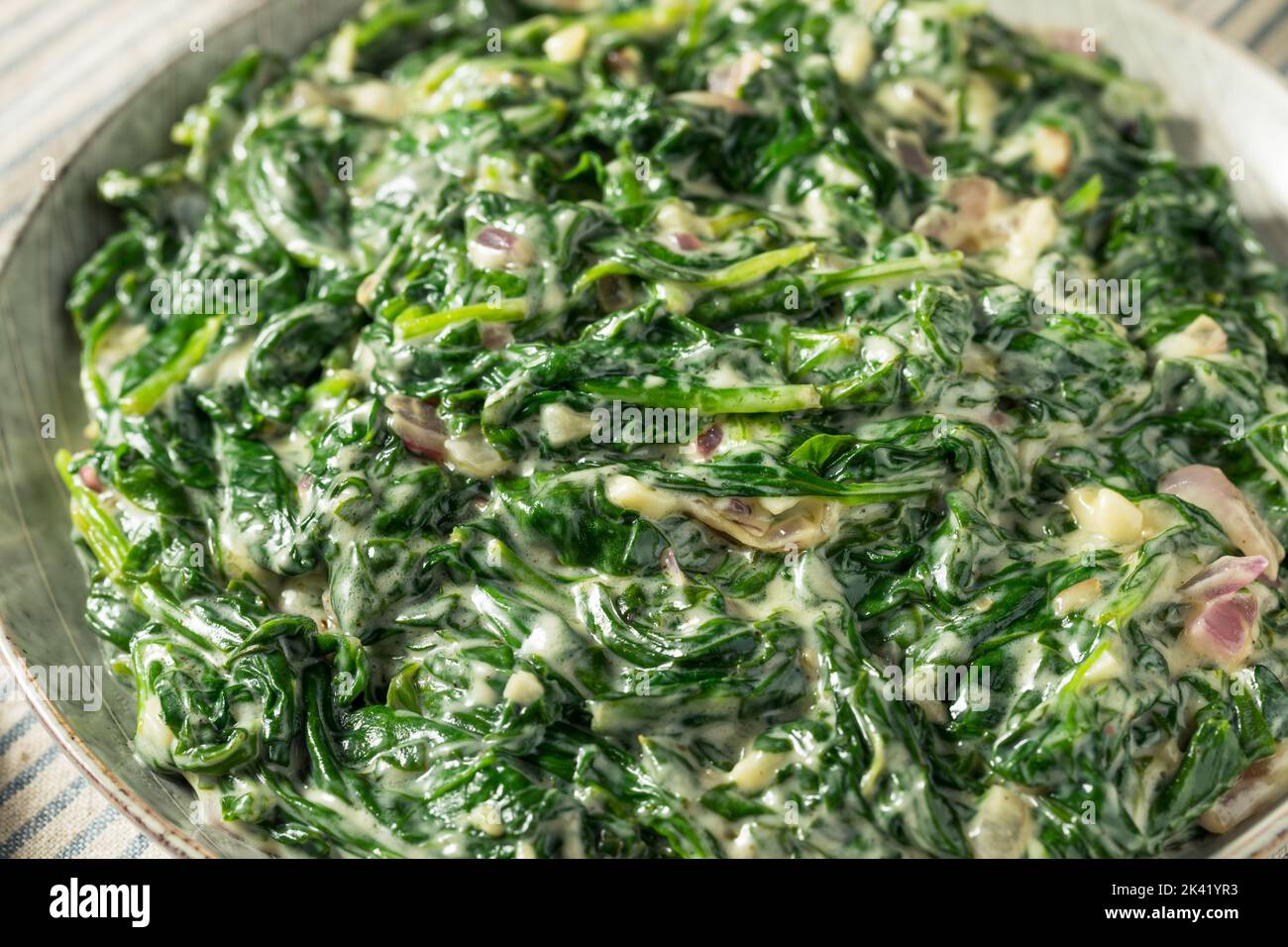Homemade Creamed Spinach Side Dish with Onion and Garlic Stock Photo
