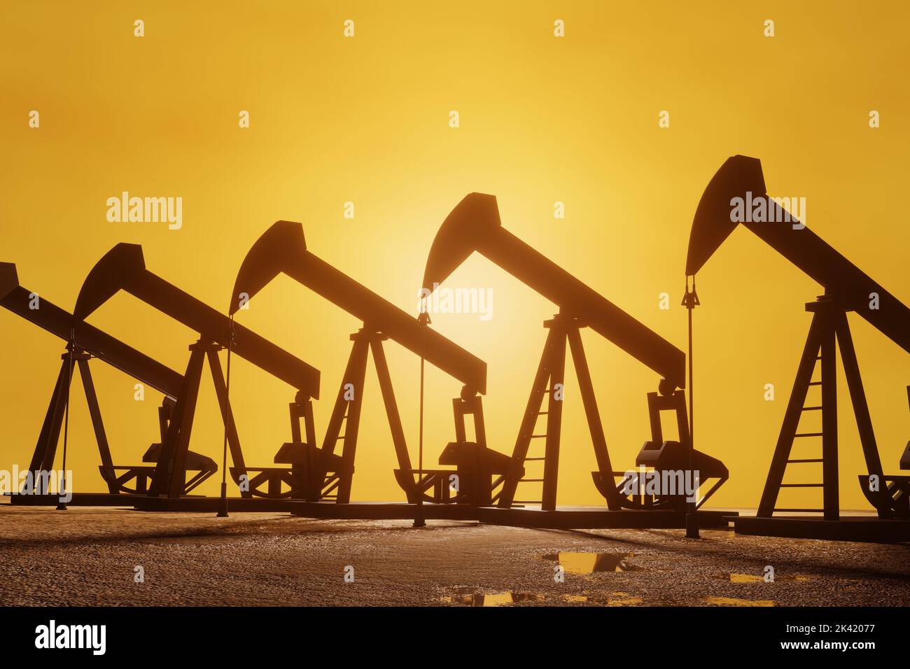 Silhouettes of petroleum wells collecting crude oil at sunset. Illustration of black oil production and soaring oil price Stock Photo
