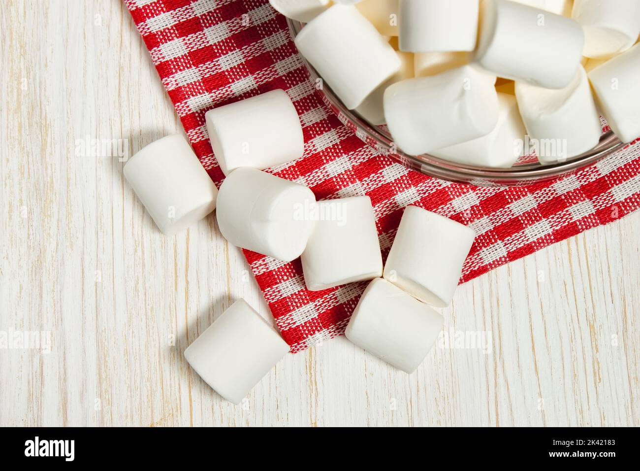 Heart shaped plate with heart shaped marshmallows, flat lay. Stock Photo by  puhimec