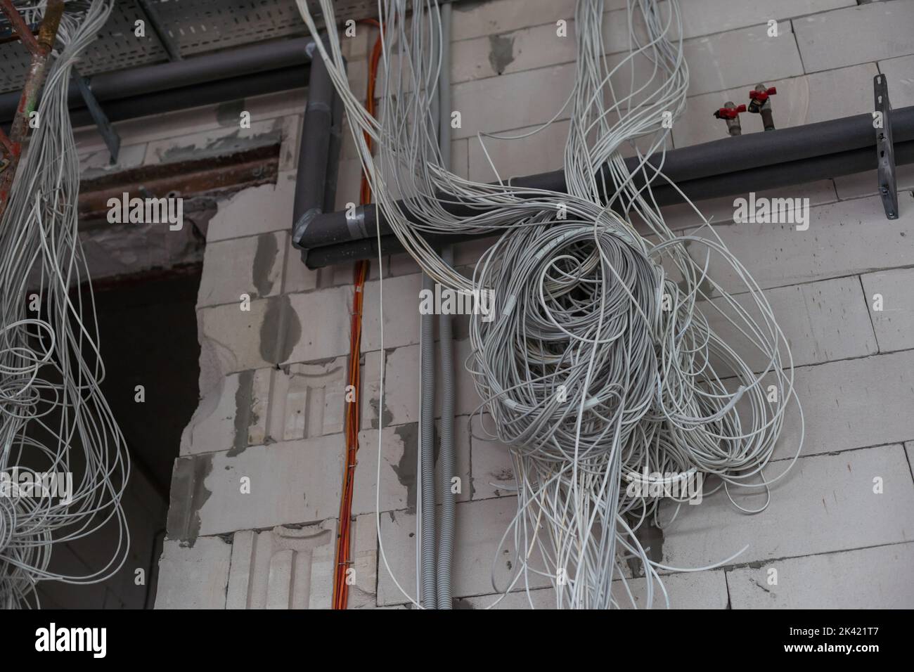 Electrical wiring work at a construction site. Wire extension Stock