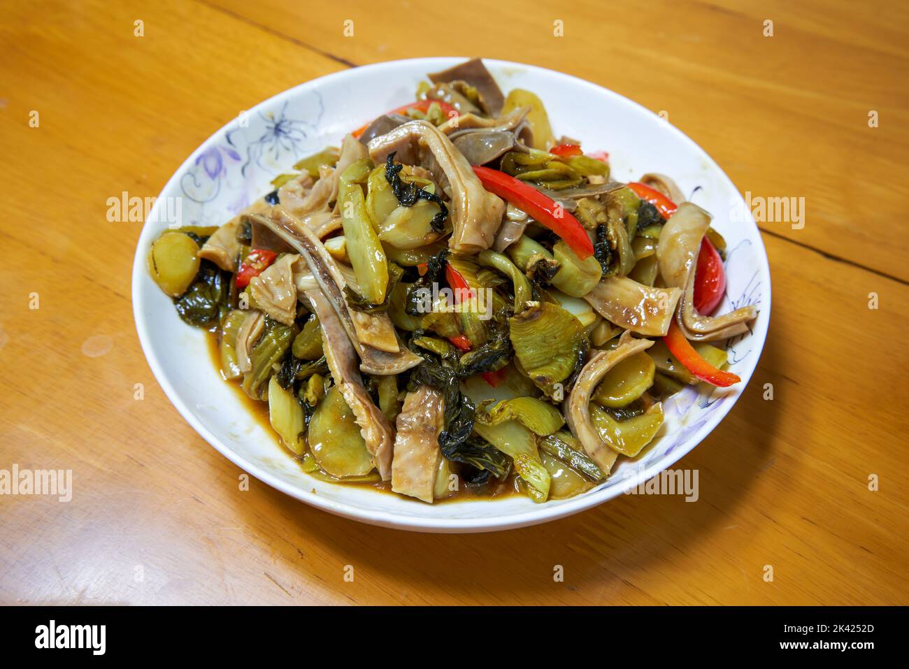 A delicious Chinese dish, fried pork belly with sauerkraut Stock Photo