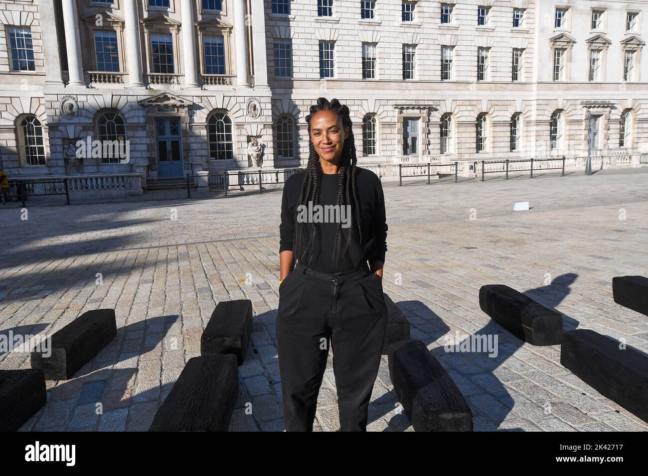 London, UK, 29/09/2022, O Barco/The Boat, large-scale installation by transdisciplinary artist Grada Kilomba, opens at Somerset House in London, to mark the 10th anniversary of 1-54 Contemporary African Art Fair. Formed of 140 wood blocks the 32-metre-long installation draws attention to the forgotten stories and identities of those who suffered during European maritime expansion and colonisation. Stock Photo