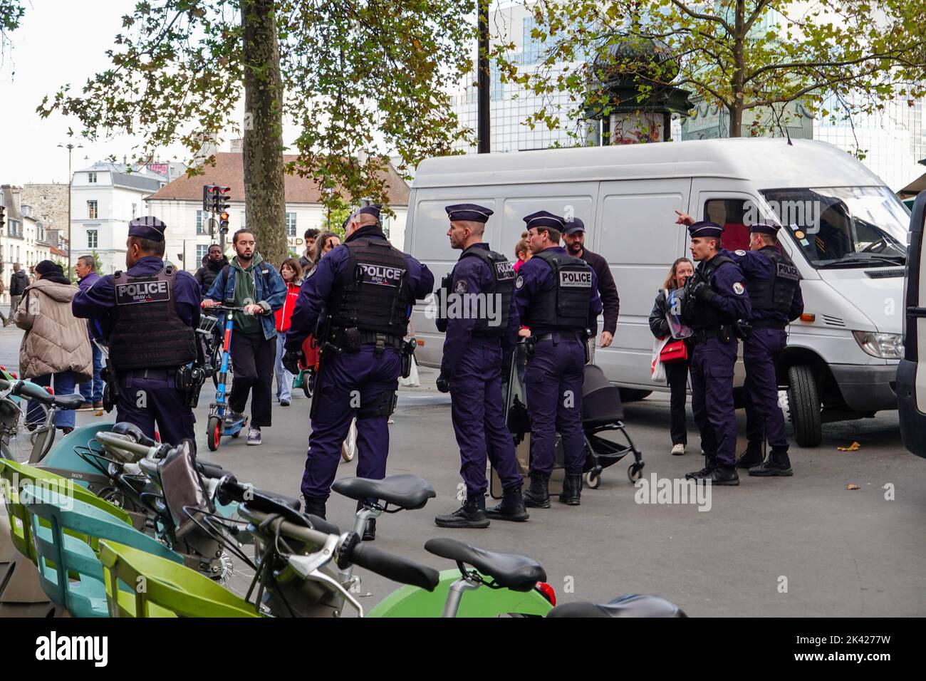 Thursday, 29 September 2022. Paris, France. Union demonstrators peacefully march from Denfert-Rochereau to Place Bastille, on nationwide day of workers protests, calling for an increase in wages due to the rise of the cost of living, and also in protest of plans by President Emmanuel Macron to reform the French retirement system. Police wait nearby, directing non-participating pedestrians away from the area of the protest. Stock Photo