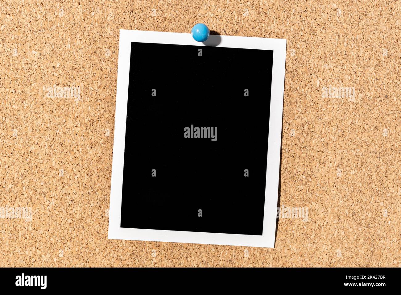 Blank Vintage instant photo frame pinned on corkboard. Template Stock Photo