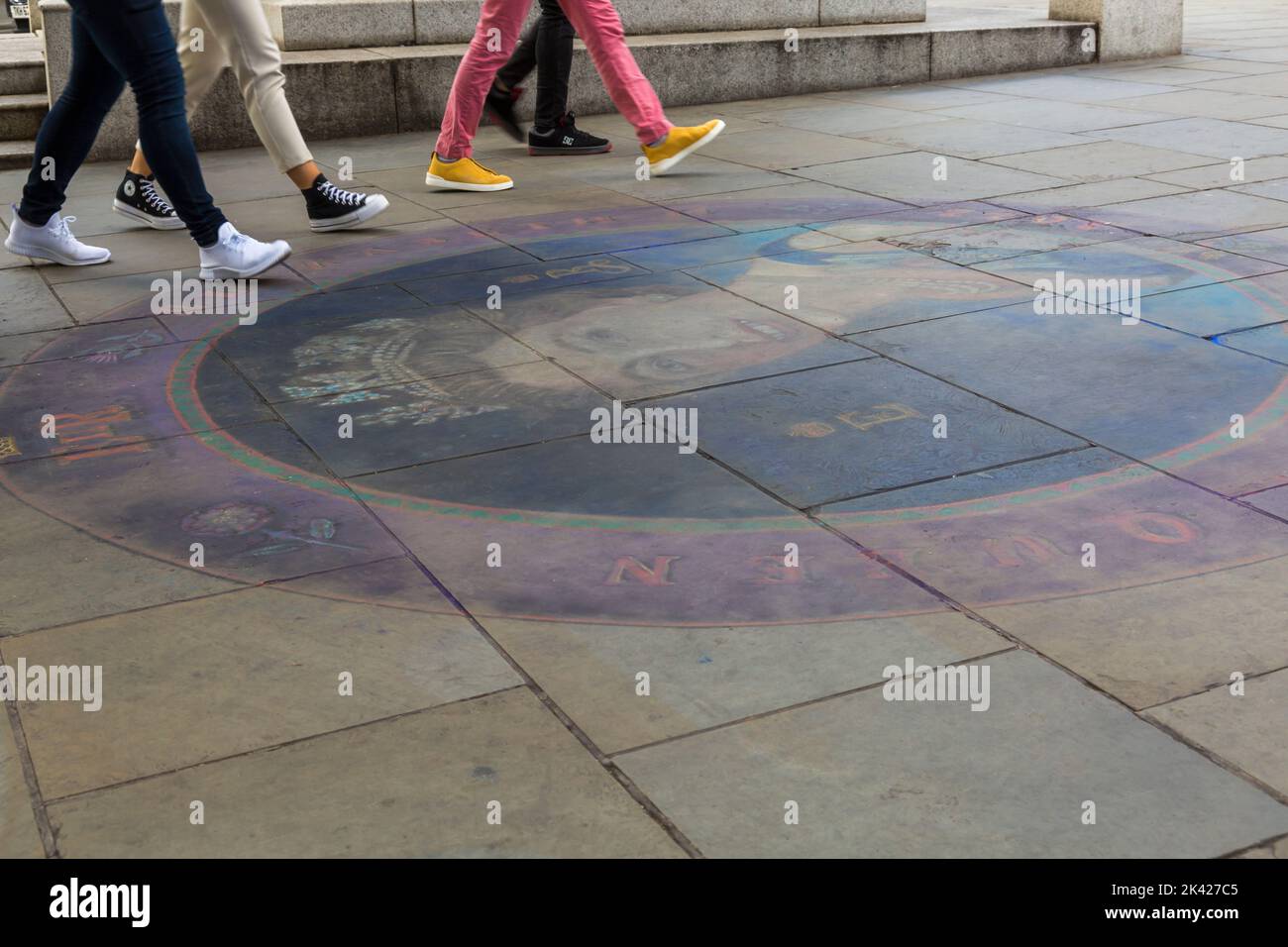 Visitors walk past drawing on ground, a tribute following the death of Queen Elizabeth II by Trafalgar Square, London UK in September Stock Photo