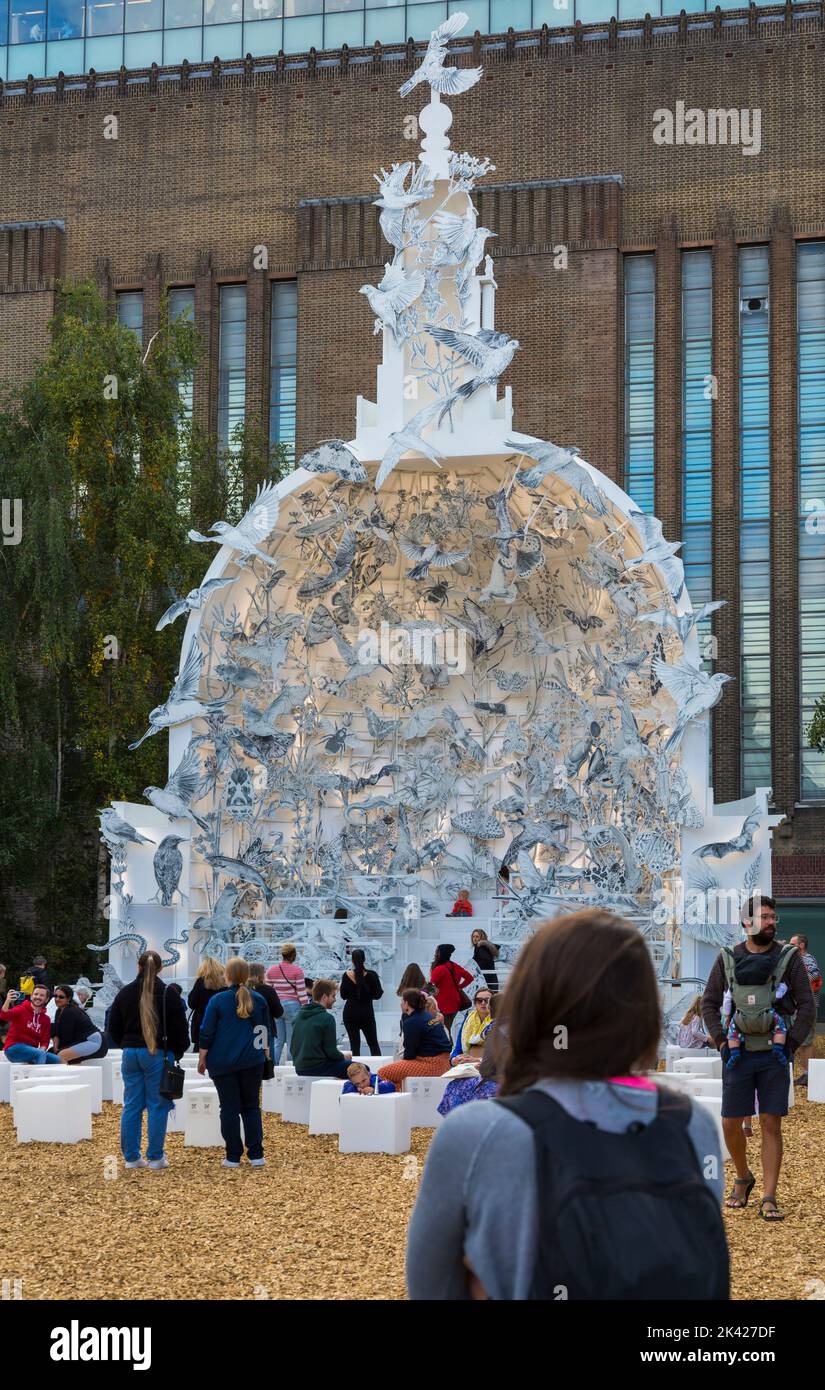 Visitors admire the 'Come Home Again' large-scale sculpture by artist Es Devlin at Tate Modern Garden, London UK in September Stock Photo