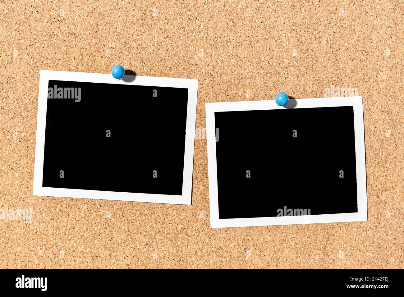 Two Blank Vintage instant photo frame pinned on corkboard. Template Stock Photo
