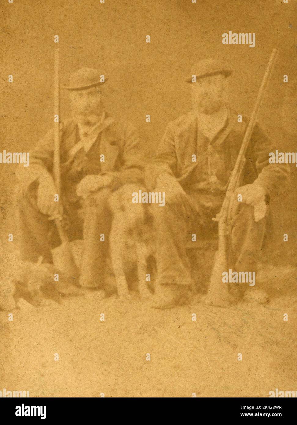 Two hunters with their rifles and the dog, Italy 1860s Stock Photo