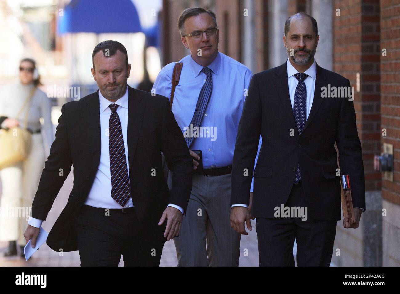 Former eBay Inc security executive Jim Baugh, with his attorneys William Fick and Daniel Marx, arrives at the federal courthouse to be sentenced after pleading guilty for orchestrating a crusade to harass a Massachusetts couple with threats and disturbing home deliveries after their online newsletter angered the company's then-CEO, in Boston, Massachusetts, U.S., September 29, 2022.     REUTERS/Brian Snyder Stock Photo
