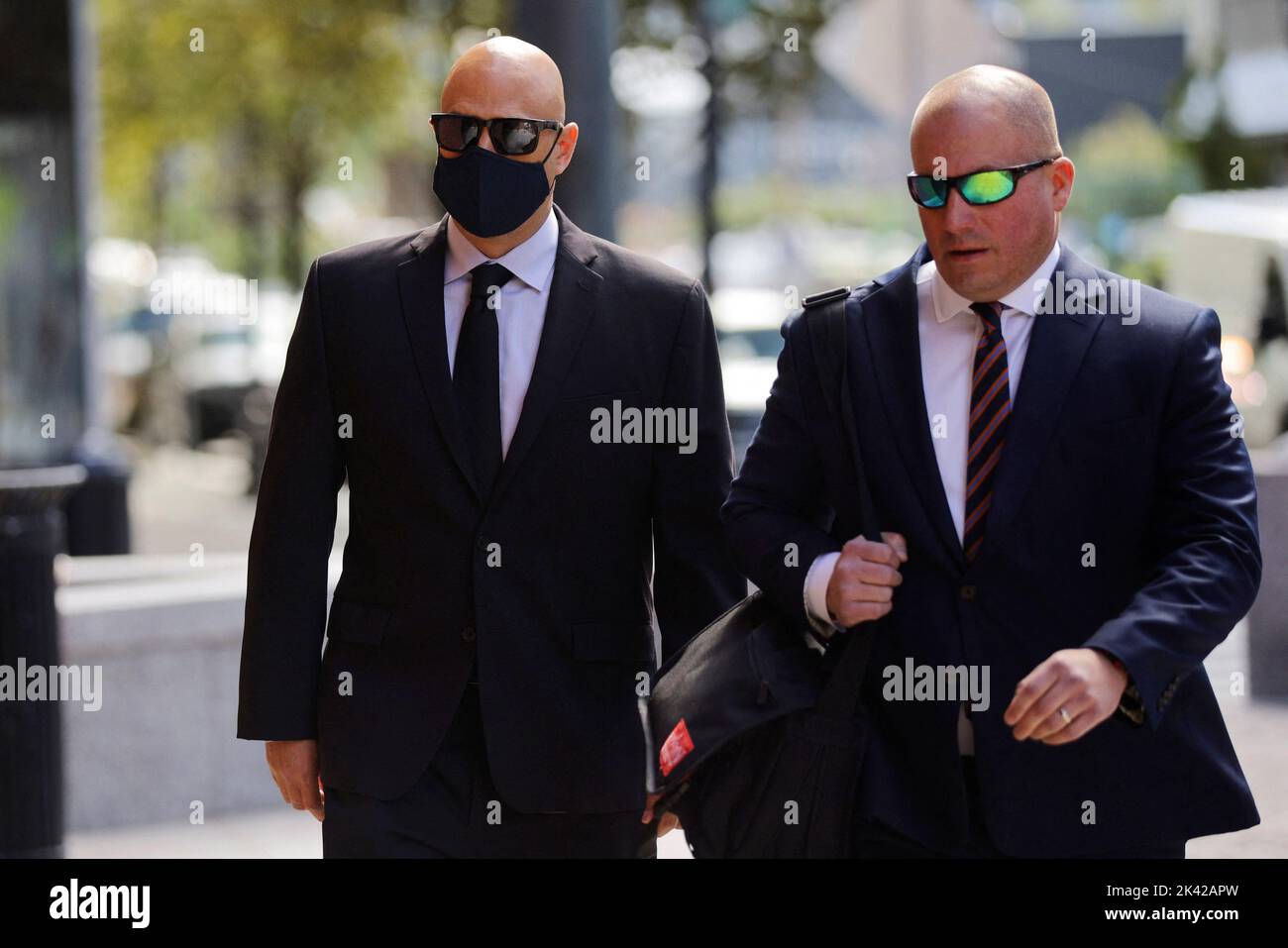 Former eBay Inc director of global resiliency David Harville, with his attorney Peter K. Levitt, arrives at the federal courthouse to be sentenced after pleading guilty for orchestrating a crusade to harass a Massachusetts couple with threats and disturbing home deliveries after their online newsletter angered the company's then-CEO, in Boston, Massachusetts, U.S., September 29, 2022.     REUTERS/Brian Snyder Stock Photo