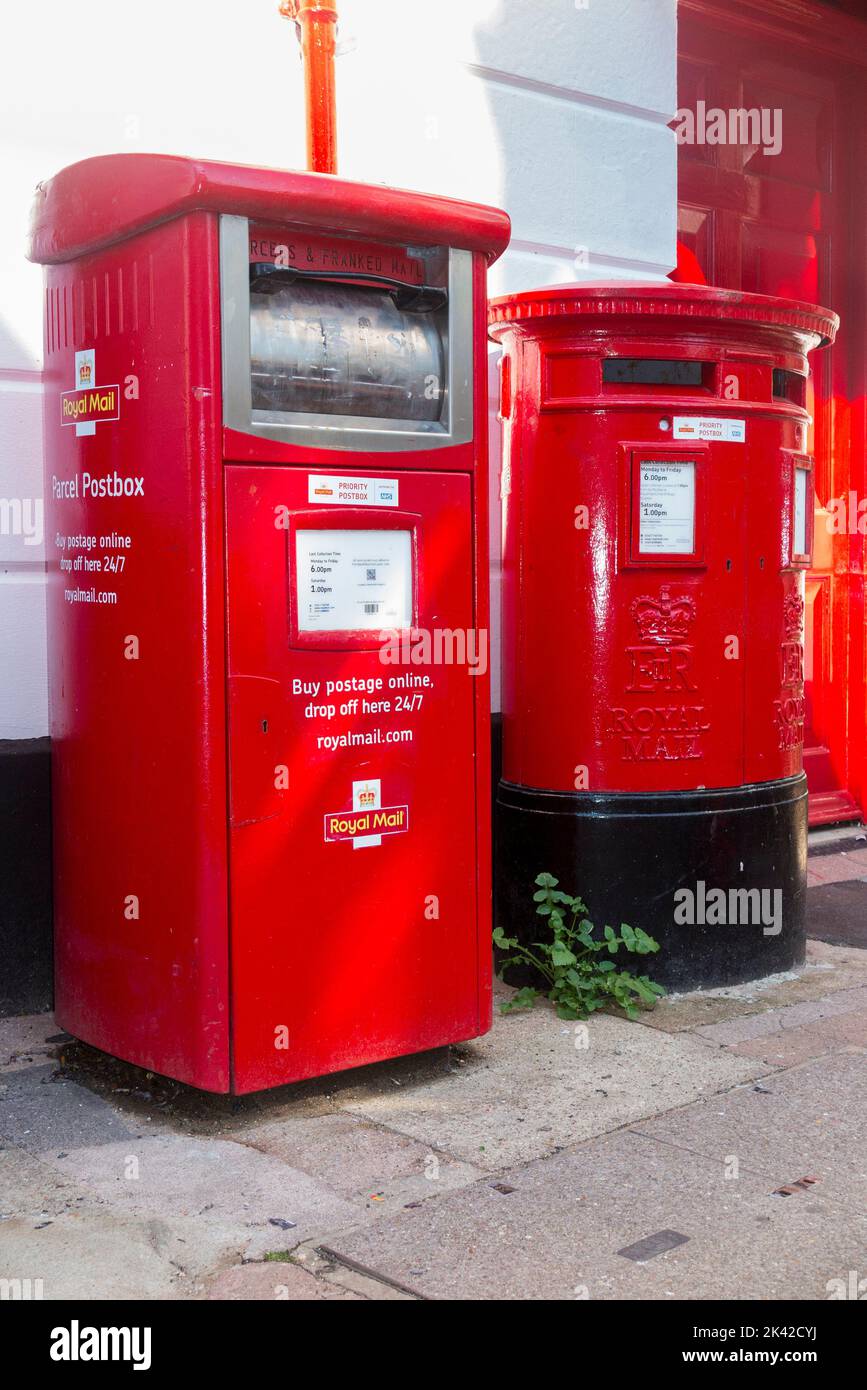 Royal Mail letter box / GPO red Post box beside a Parcel and priority postbox and franked mail