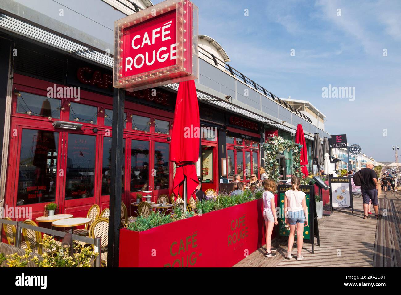 Branch of the restaurant chain Cafe Rouge in Brighton Marina, East Sussex, city of Brighton & Hove, UK. Sunny day with blue skies and bright sun. (131) Stock Photo