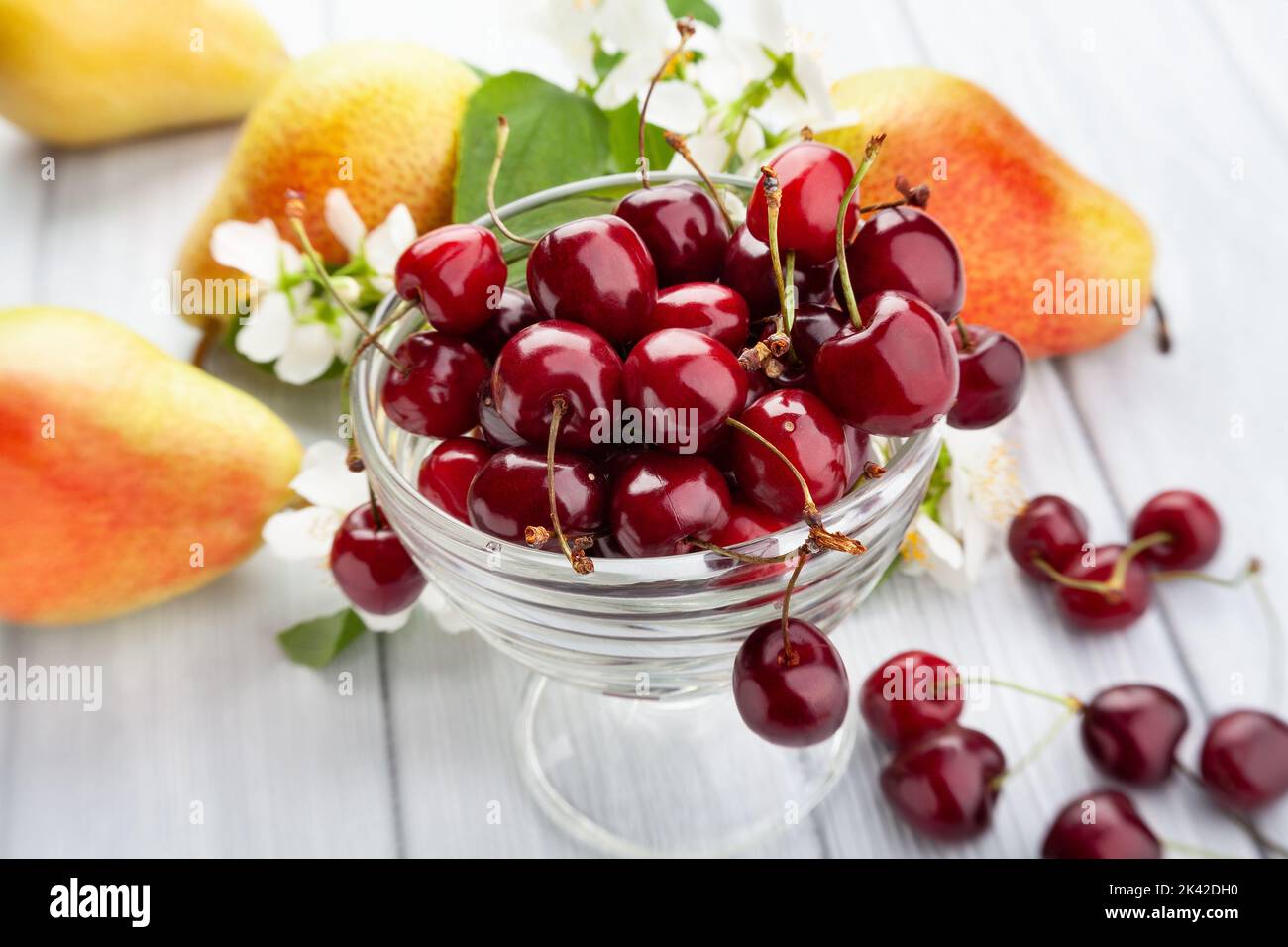 red cherries on wood background Stock Photo