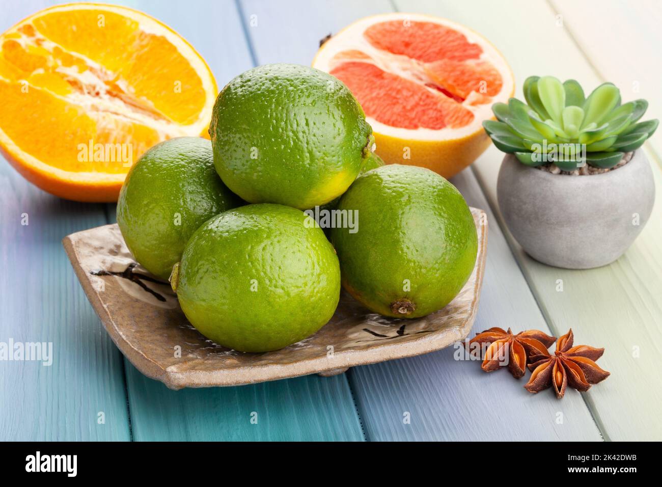 lime on a plate on wood background Stock Photo